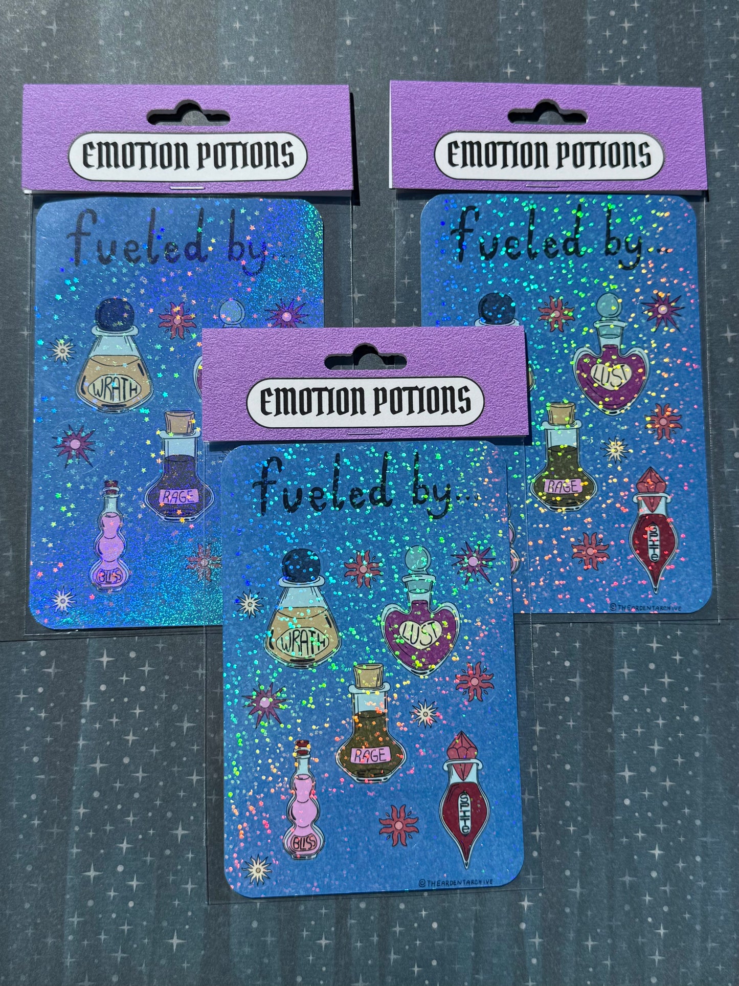 Three 'Emotion Potions' themed cards with colorful designs on a dark background.
