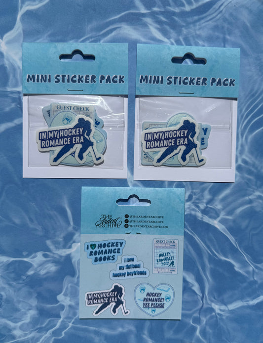 Three mini sticker packs with 'In My Hockey Romance Era' theme on a blue textured background.