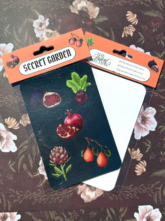 Sticker sheet with pomegranate, beet, and pear designs on a floral background