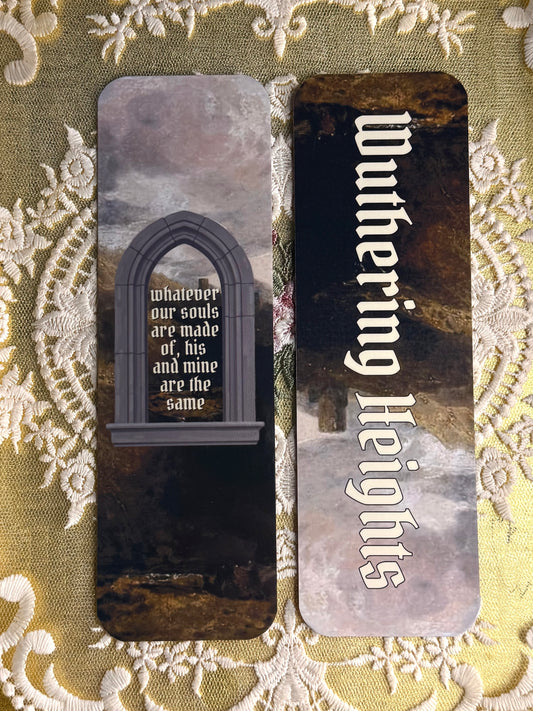 Bookmarks with 'Wuthering Heights' text and gothic design on a decorative fabric background