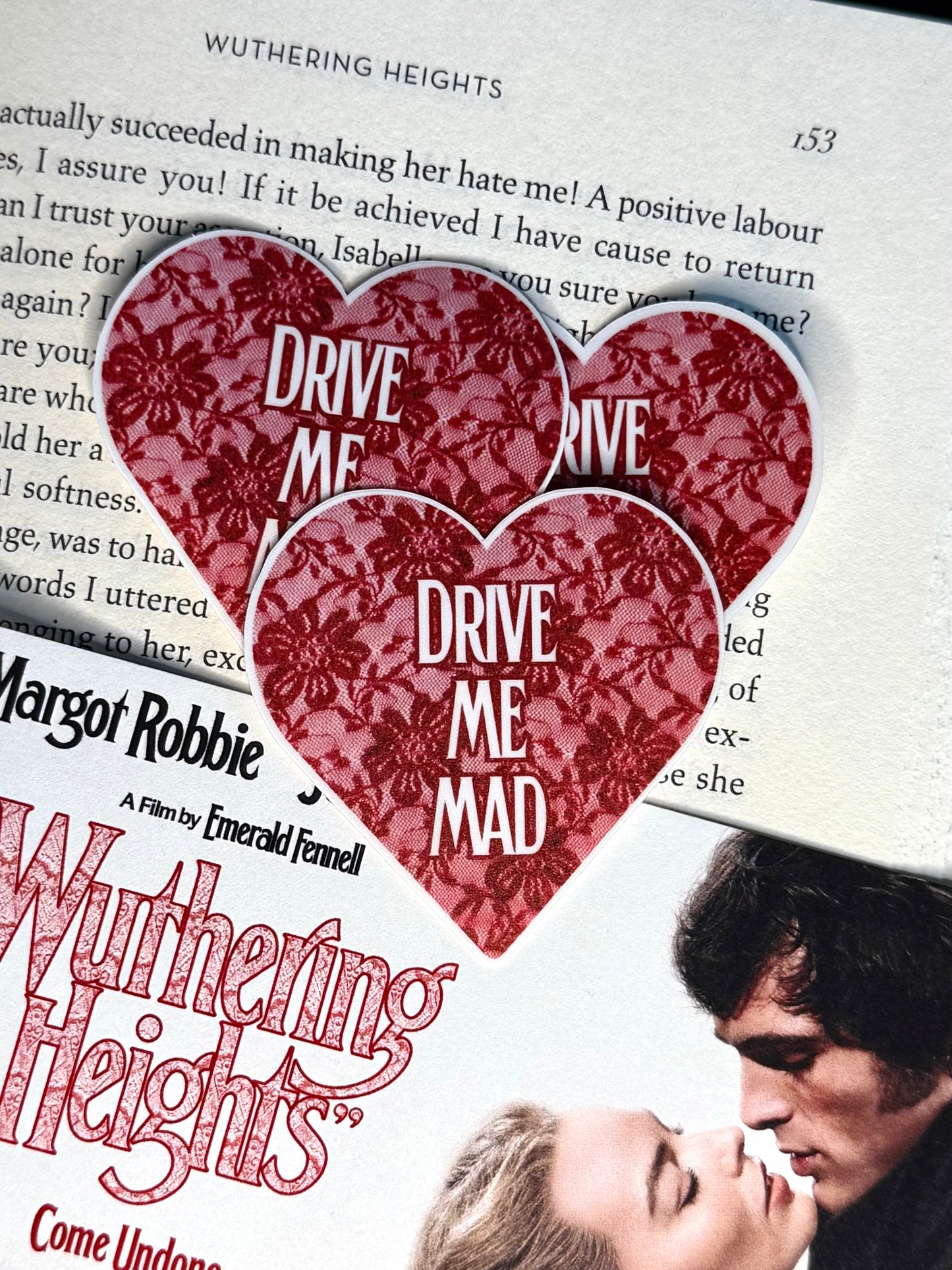 Movie ticket for 'Wuthering Heights' with heart-shaped cutout and text overlay.