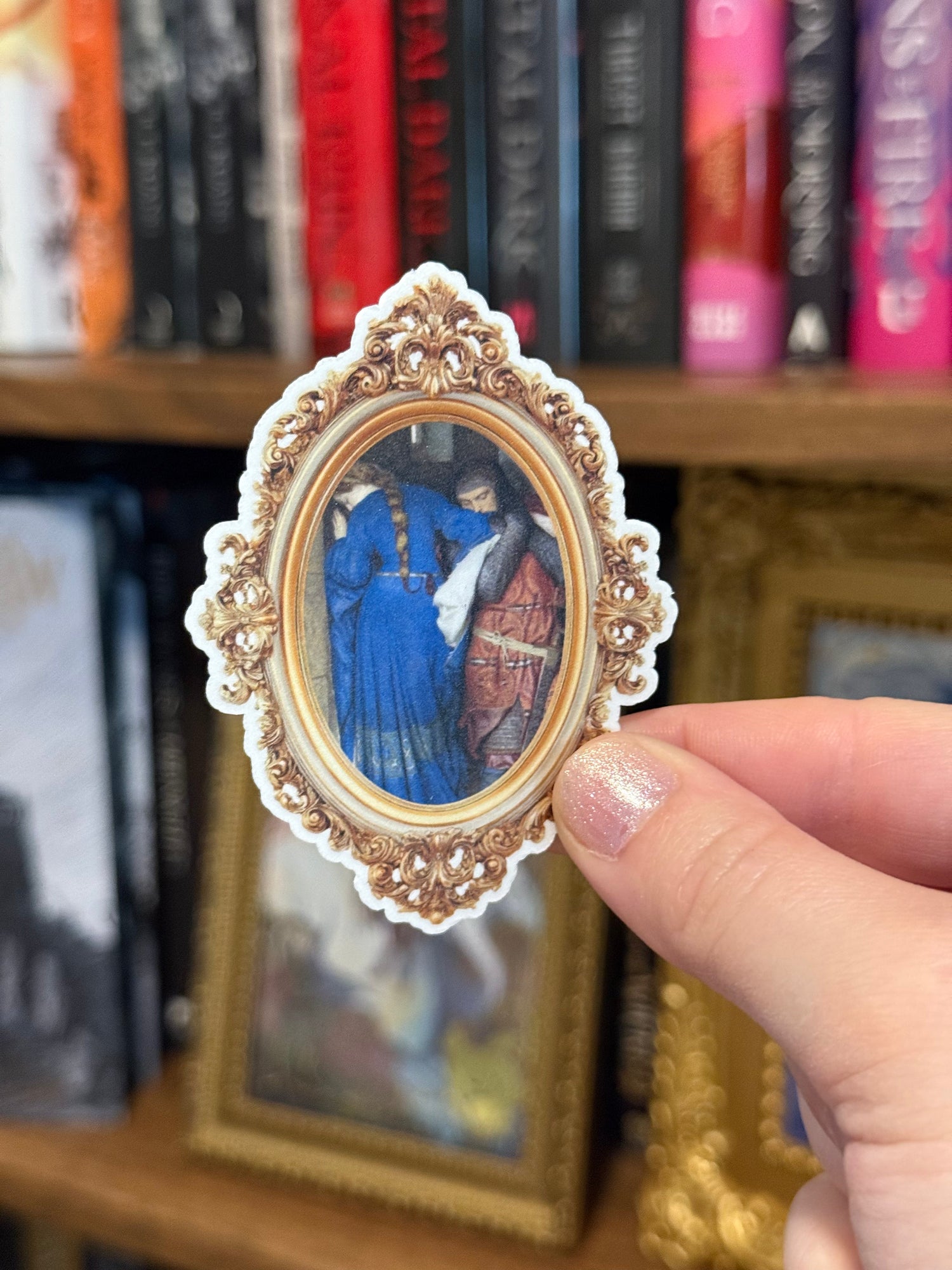 Decorative religious pendant held in front of stained glass windows