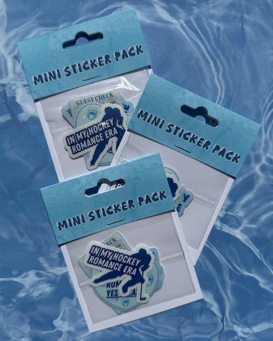 Three mini sticker packs with hockey-themed stickers on a blue water background
