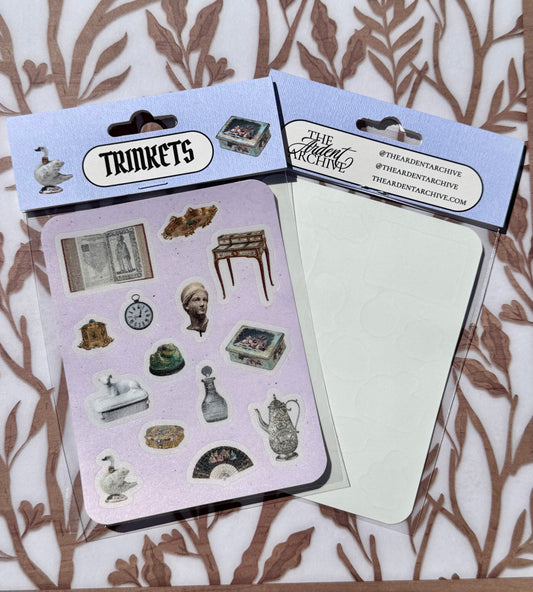 Two packages of decorative stickers with 'Trinkets' branding on a patterned background.