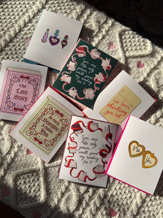 Collection of valentines day greeting cards on a textured fabric surface