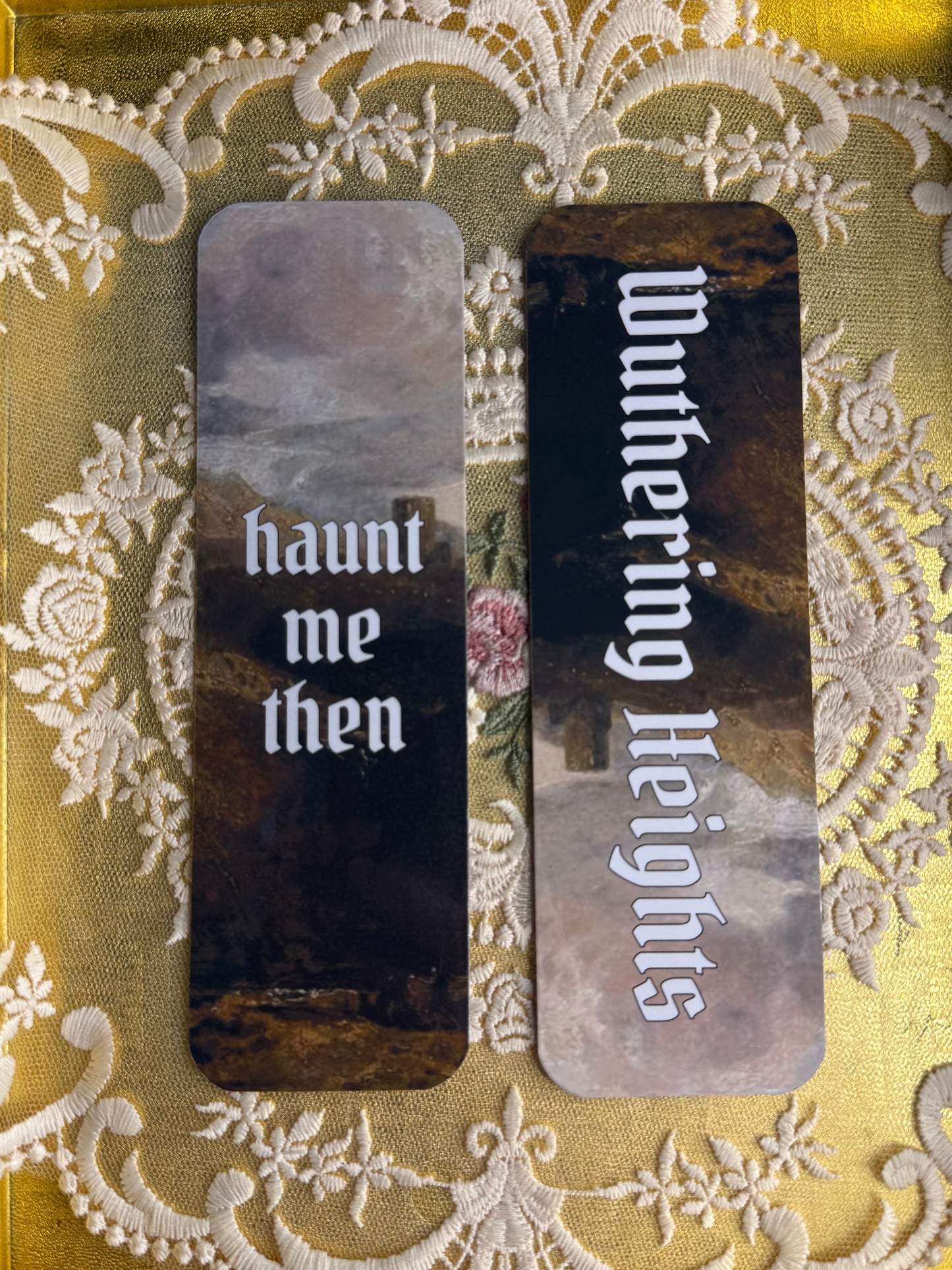 Bookmarks with text 'haunt me then' and 'Wuthering Heights' on a decorative background.