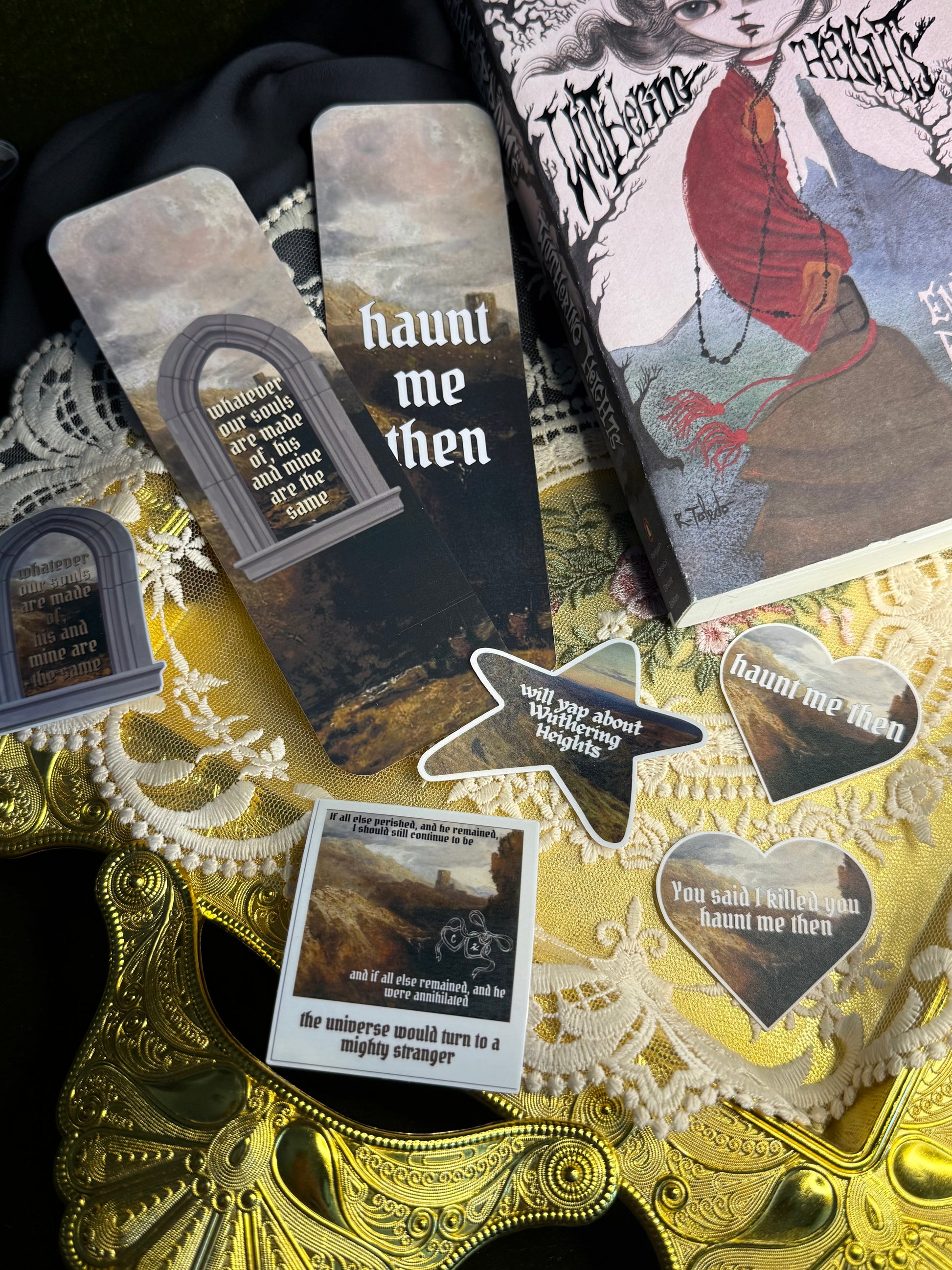 Collection of Wuthering Heights themed bookmarks and stickers on a decorative book and gold background
