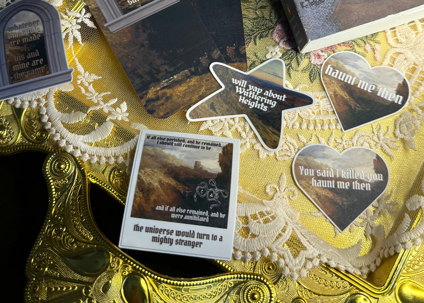 Collection of  Wuthering Heights themed bookmarks and stickers on a decorative background