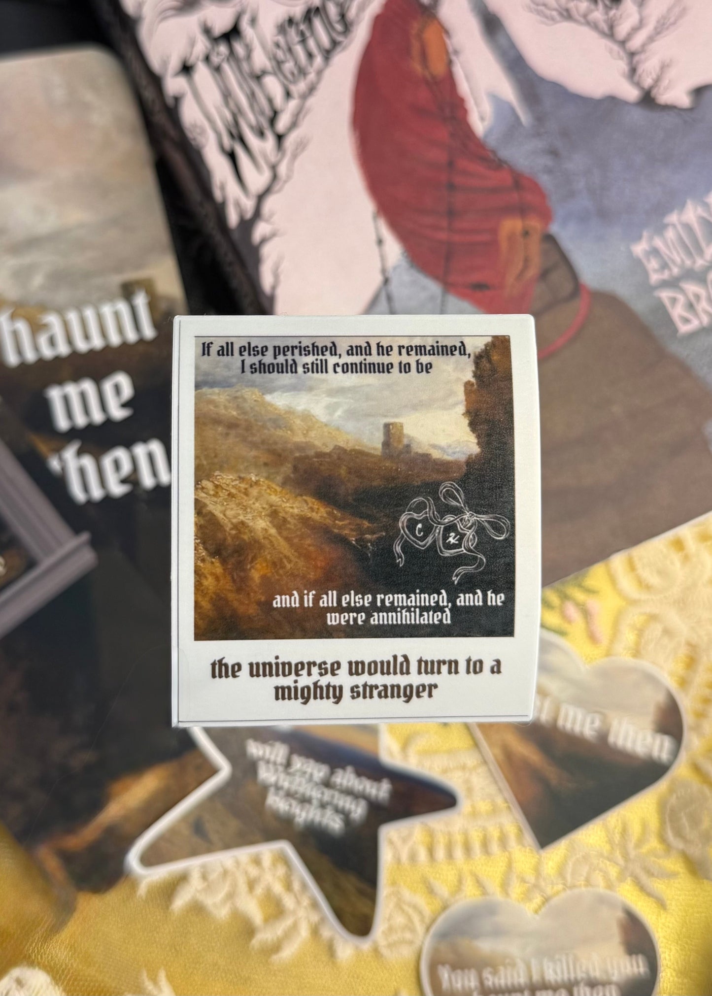 Sticker shaped like a polaroid with text and a scenic illustration on a collage background