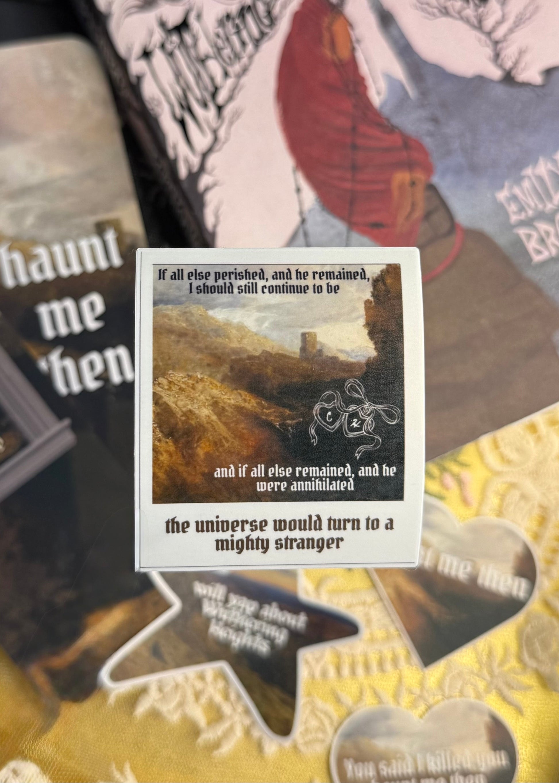 Sticker shaped like a polaroid with text and a scenic illustration on a collage background