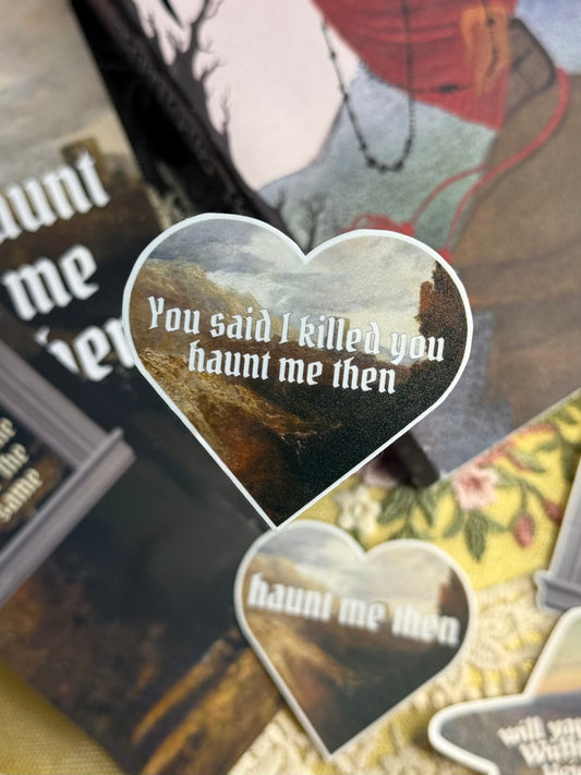 Heart-shaped sticker with text 'You said I killed you, haunt me then' on a collage background.