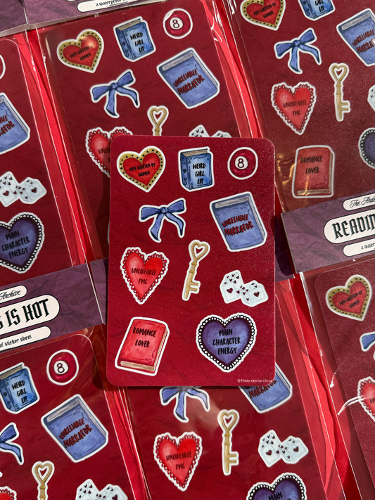 Packaged red sticker sheet with books, hearts, keys, and bow designs on a red background. Watercolor style. 