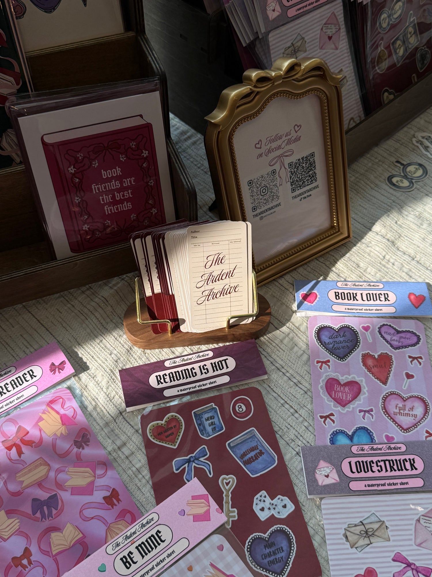 Collection of greeting cards and decorative items on a textured surface